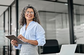 Confident, mature woman in business setting
