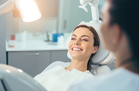 Smiling dental patient in treatment chair