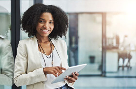 smiling confident woman wearinf business casual attire