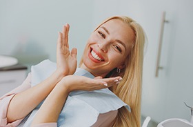 Happy dental patient showing off her smile