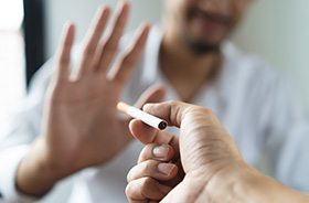 Man saying no to offer of a cigarette