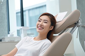 Happy patient in dental chair