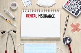 Dental insurance written on notepad